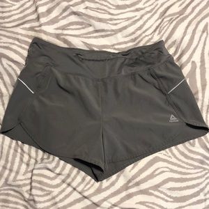 Gray Reebok athletic shorts, size L